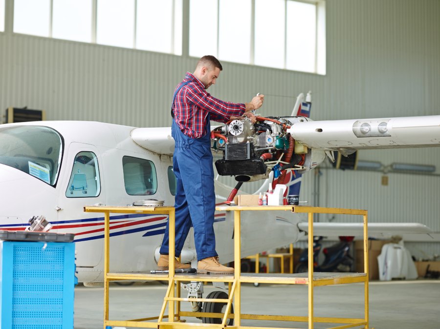 Aviation training mentor working with aircraft systems